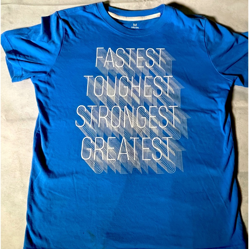 Blue T-Shirt with Bold White "Fastest,
Toughest, Strongest, Greatest" Print